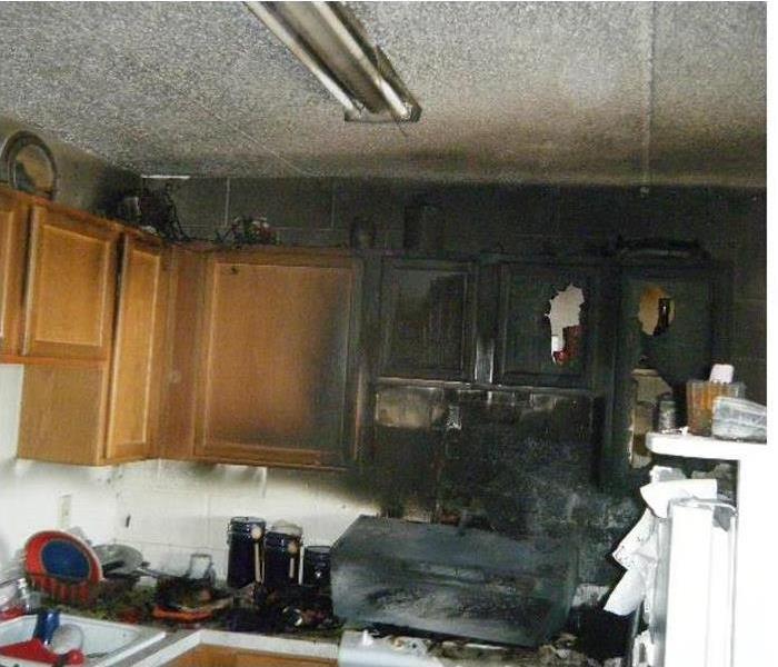 Kitchen with significant fire damage