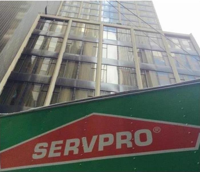 SERVPRO vehicle with high-rise building in background